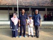 Harumkan Karawang, Azriel Raih Medali Emas di Kejurda Kick Boxing